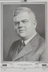 Halftone portrait of Theodore Christianson, a heavy-set man with light hair combed back, in a suit and striped tie, inside a decorative border topped by an eagle; the caption reads "Theodore Christianson, Governor of Minnesota."