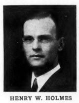 Small halftone head-and-shoulders photograph of Henry W. Holmes wearing rimless glasses, a white collar and dark tie; the printed caption below reads "Henry W. Holmes."