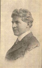 Halftone head-and-shoulders portrait of Edwin D. Starbuck in left profile, a man with thick wavy hair, in a dark suit and high white collar, with his signature across the lower right; the printed caption reads "Dr Edwin D. Starbuck, An Apostle of Character Training."